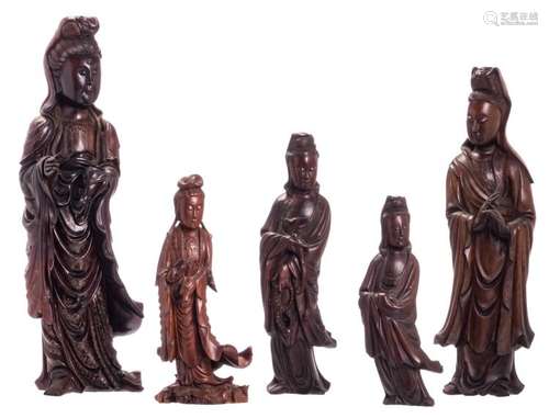 Five Chinese carved hardwood figures depicting a Guanyin, one figure with copper inlay, 19th - 20thC, H 29 - 55 cm