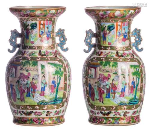 A pair of Chinese famille rose floral decorated Canton vases, the roundels depicting the Eight Immortals and animated scenes, H 34 cm