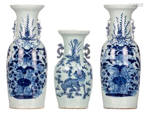 A pair of Chinese celadon ground blue and white vases decorated with flower branches; added a ditto vase, decorated with a phoenix and a Fu lion, the handles dragon relief decorated, 19thC, H 44 - 58 cm