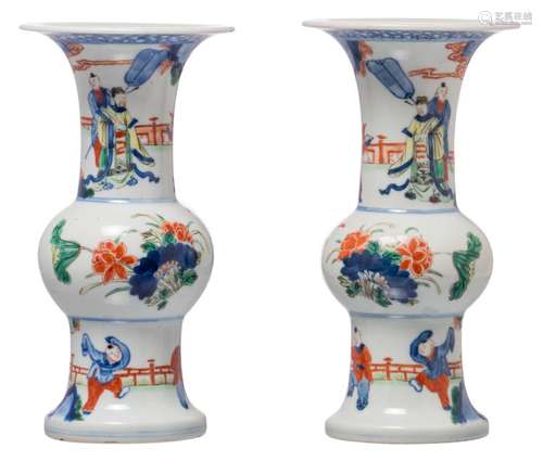 A pair of Chinese wucai overall decorated yenyen vases with figures in a garden and flower branches, with a Wanli mark, H 23 cm