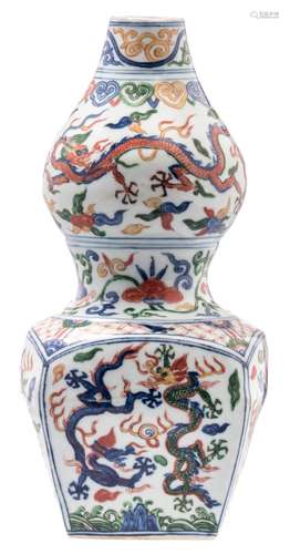 A Chinese wucai double gourd vase with a quadrangular base, decorated with dragons and flaming pearls, with a Jiajing mark, H 28 cm