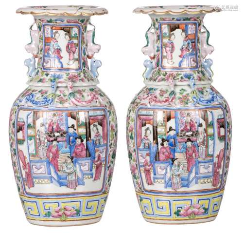 A pair of Chinese famille rose floral and relief decorated vases, the roundels with court scenes, H 42 cm