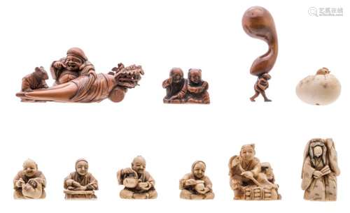 A lot of seven Japanese ivory netsuke / okimono and three ditto wooden okimono, all depicting streetsellers, twin boys, mythological figures and a chick in an egg, Meiji period and first half of the 20thC, H 3,3 - 8,5 cm