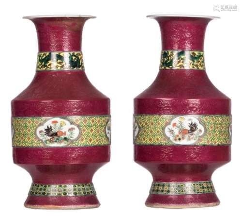 A pair of Chinese ruby ground baluster shaped vases, polychrome and relief decorated, the roundels with birds and flower branches, H 43,5 cm