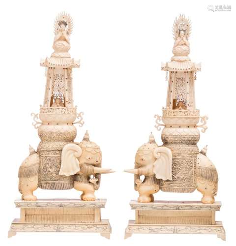 A pair of Chinese carved ivory and jewelled elephant pagodes with greeting Bouddha and Guanyin, with certificate, about 1930, H 58,5 - W 28 - D 14,5 cm - Total weight: about 8300g