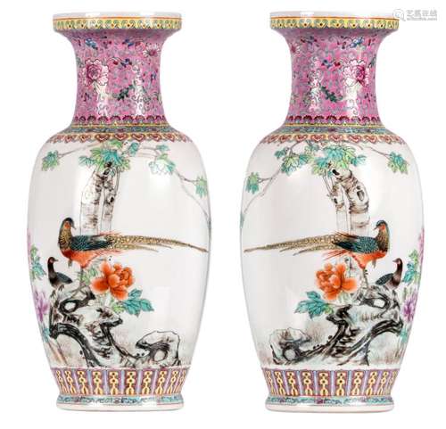 A pair of Chinese famille rose vases, decorated with pheasants on a rock and flower branches, marked, H 46,5 cm