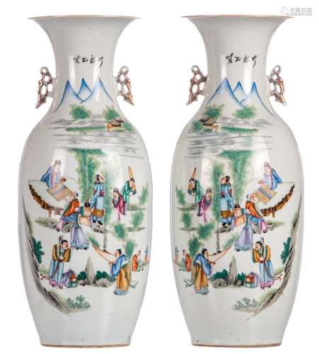 A pair of Chinese polychrome vases, decorated with literati in a landscape and calligraphic texts, H 59 cm