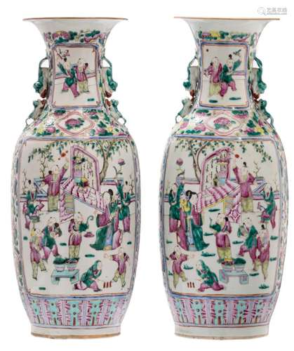 A pair of Chinese famille rose and floral decorated vases, the roundels depicting children playing in a garden, 19thC, H 60,5 cm