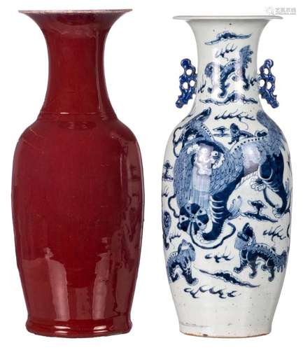 A Chinese sang de boeuf vase, 19thC; added a Chinese blue and white decorated vase with Fu lions, 19thC, H 58 - 59 cm