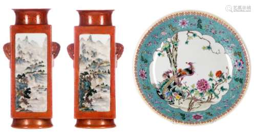 A pair of Chinese orange ground polychrome decorated quadrangular vases with mountainous river landscapes and calligraphic texts, Daoguang marked, H 36,5 cm; added a Chinese polychrome and famille rose decorated plate with floral motifs, birds and flower branches, marked, ø 37 cm