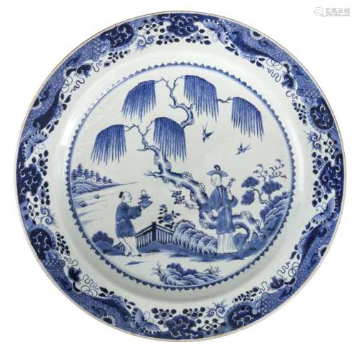 A Chinese blue and white decorated plate with a gallant scene in a mountainous river landscape, Kangxi, ø 55 cm