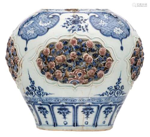 A Chinese cobalt blue and copper red glazed vase, the roundels floral relief decorated, Ming, H 30 cm