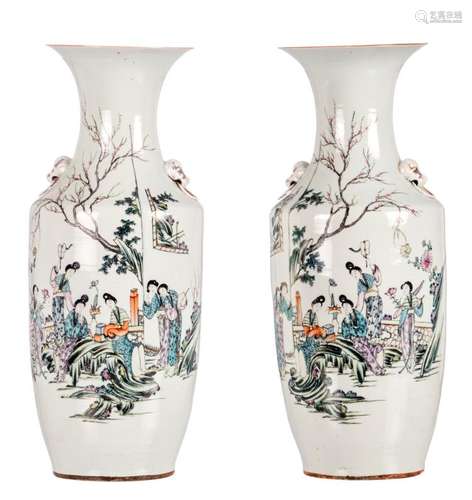 A pair of polychrome decorated Chinese vases, with an elegant garden scene and calligraphic texts, H 57,5 cm