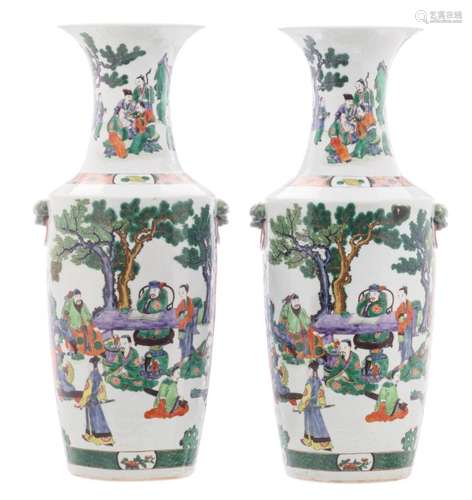 A pair of Chinese famille verte vases, overall decorated with an animated garden scene, H 62 cm