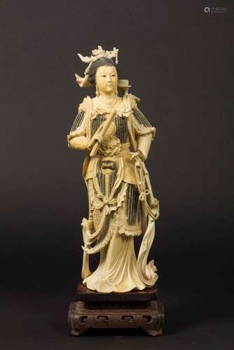 A carved ivory figure of Guanyin with a sword, China, early  ...