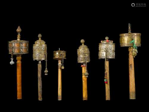 Six copper prayer wheels with semi-precious stone inlays,  ...