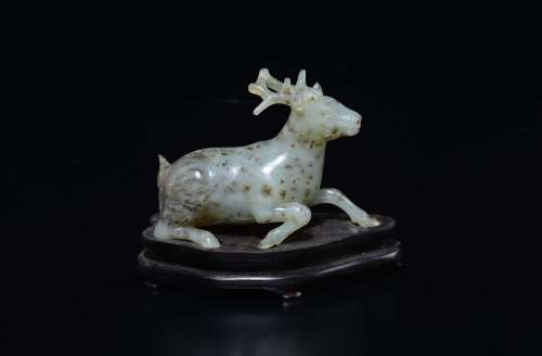A white and russet jade figure of a deer, China, Qing Dynasty,  ...