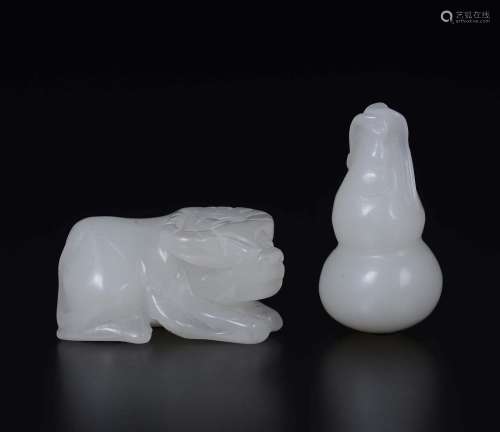 Two carved white jades: a small fruit and a buffalo, China,  ...