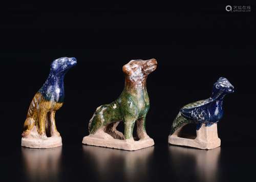 Three glazed pottery figures, two dogs and a pheasant, China,  ...