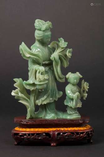 A jadeite Guanyin and child group, China, early 20th centu ...