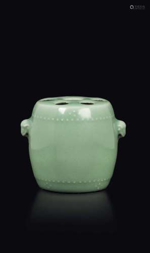 A small pale Celadon porcelain brushpot with monkey's head-handles,  ...