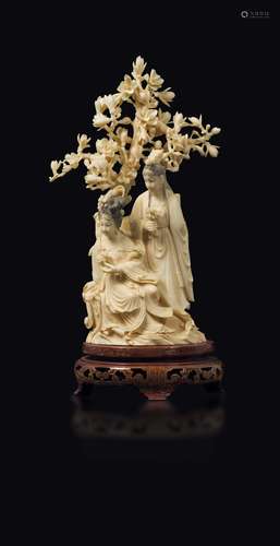 A carved ivory Guanyin under a tree group, China, early 20th  ...