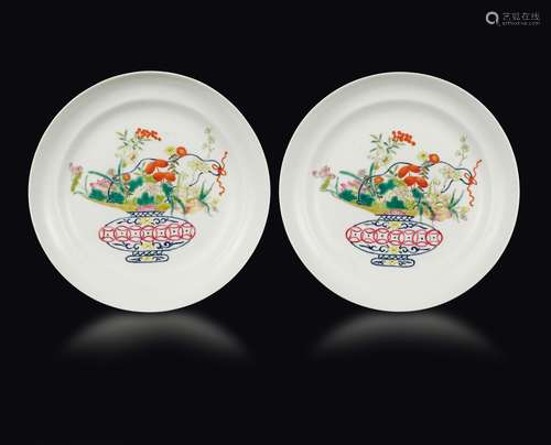 A pair of polychrome enamelled porcelain dishes with flower  ...