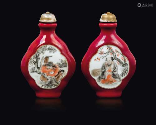 A pair of red-ground porcelain snuff bottles with wise men  ...