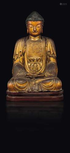 A gilt and lacquered wood figure of seated Buddha, China,  ...