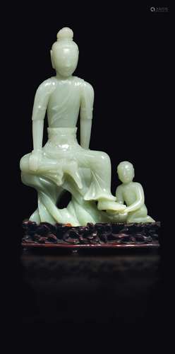 A white jade Buddha and child group, China, Qing Dynasty,  ...