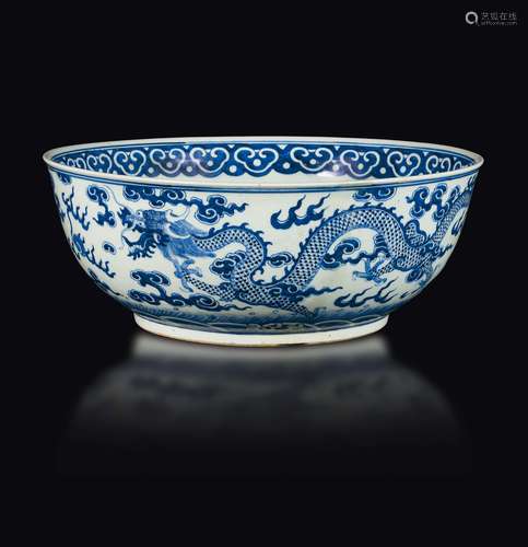 A large blue and white bowl with dragons between clouds, China,  ...