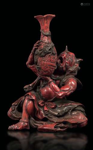 A red lacquer figure of demon with vase, Japan, 19th centu ...