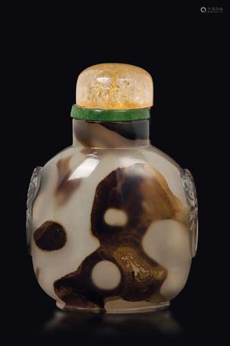 A moss agate snuff bottle with mask handles, China, Qing Dynasty,  ...