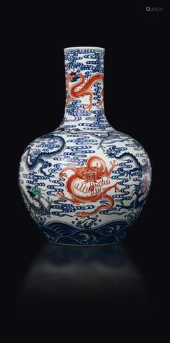 A polychrome enamelled porcelain vase with dragons between  ...