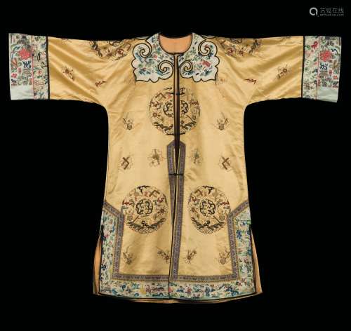 A yellow-ground silk dress embroidered with naturalistic motif,  ...