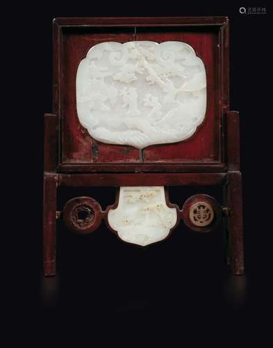 A wooden table screen with white jade plaques with common  ...