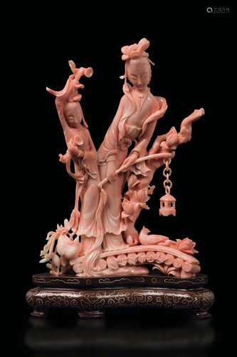 A carved coral Guanyin group, China, early 20th century