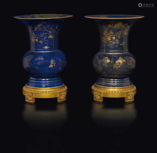 Two blue-ground porcelain vases with gilt decoration on a  ...