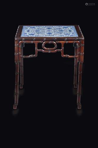 A rare wooden table with blue and white plaque depicting bats,  ...