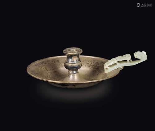 A silver candlestick with white jade dragon belthook handle,  ...