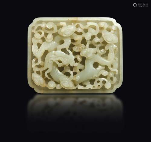 A white jade plaque with naturalistic decoration in relief,  ...