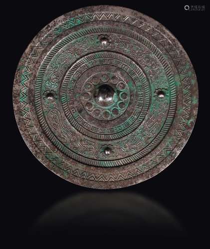 A bronze Bo Ju mirror with central boss, China, Han Dynasty  ...