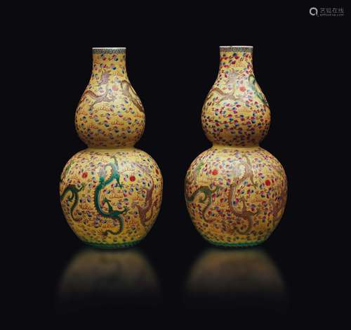 A pair of yellow-ground porcelain double-pumpkin vases with  ...