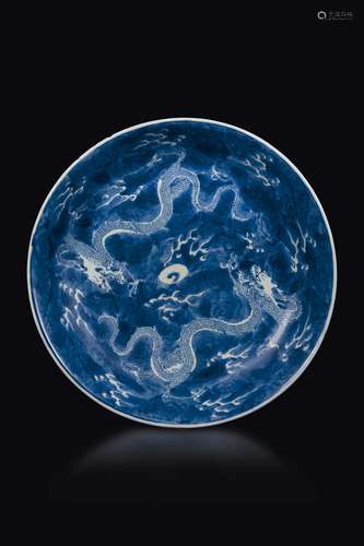 Two blue and white porcelain dishes, one with dragons and  ...