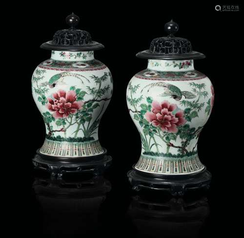 A pair of polychrome enamelled porcelain potiches and wooden  ...