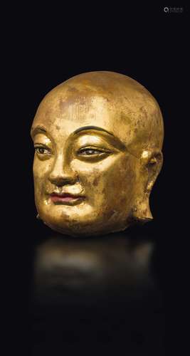 A gilt and painted stucco Luohan's head, China, Qing Dynasty,  ...