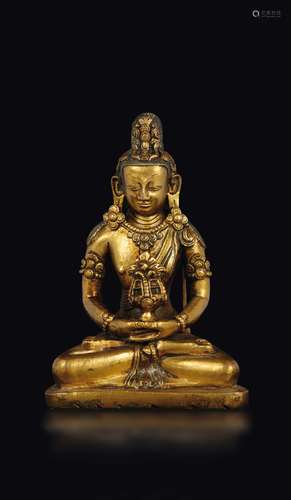 A gilt bronze figure of Amithaba, Tibet, 14th century