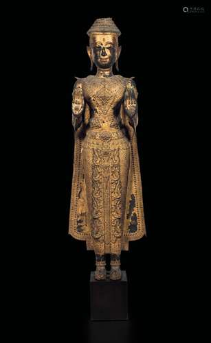 A large gilt bronze figure of standing Buddha, Thailand, Ayutthaya,  ...