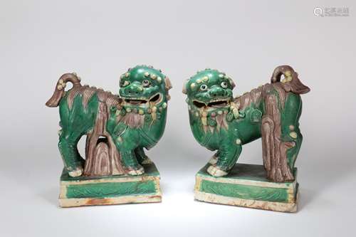 A Pair of Chinese Carved Porcelain Loin Statues