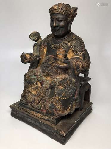 Chinese wood carving of the God of Money